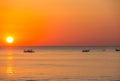 Fishing boats pull their nets at the sunrise. Adriatic cost. Emilia Romagna. Italy Royalty Free Stock Photo