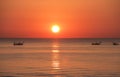 Fishing boats pull their nets at the sunrise. Adriatic cost. Emilia Romagna. Italy Royalty Free Stock Photo