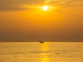Fishing boats pull their nets at the sunrise. Adriatic cost. Emilia Romagna. Italy Royalty Free Stock Photo