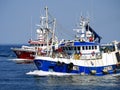 Fishing Boats Racing to Harbour. Royalty Free Stock Photo