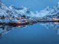 Fishing boats at Reine harbor in winter dawn