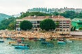 Fishing boats rest in Stanley Bay on Hong Kong Island with Murray House on background. Beautiful scenic landscape in the eveninig