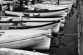 Black and white Fishing boats in row order at the Port of Bardolino Italy Royalty Free Stock Photo