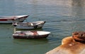 Fishing boats and rusty iron bollard Royalty Free Stock Photo