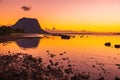 Fishing boats in the sea at sunset time. Le Morn mountain in Mauritius Royalty Free Stock Photo