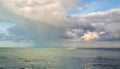 Fishing boats in the sea under the clouds.