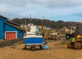 Fishing boats on the shore, stony beach, fishing industry,