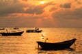 Fishing boats, small boats floating in the sea at sunrise, Concept sea in the morning.