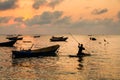 Fishing boats, small boats floating in the sea at sunrise, Concept sea in the morning.