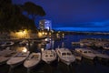 Fishing boats in small mediterranean port at dusk