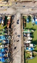 Fishing boats in a small port, aerial overhead view from drone Royalty Free Stock Photo