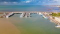 Fishing boats in a small port, aerial overhead view from drone Royalty Free Stock Photo