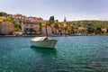 Fishing boats in Splitska village with beautiful port, Brac island, Croatia. Village of Splitska on Brac island seafront view, Royalty Free Stock Photo