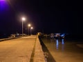 Fishing boats standing at night at the pier