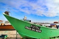 Fishing boats stranded on Aguda beach and little houses in the background