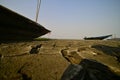 Fishing boats stranded on the dry lake bed of Lake Chilika, India. Royalty Free Stock Photo