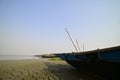 Fishing boats stranded on dry lake bed of Lake Chilika, India. Royalty Free Stock Photo