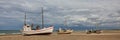 Fishing boats at Thorup Beach on a cloudy summer day