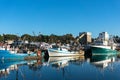 Fishing boats, trailers at port