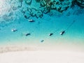 Fishing boats in transparent ocean and white sand beach on paradise island. Aerial view Royalty Free Stock Photo