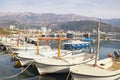 Fishing boats on water. Beautiful mediterranean landscape on foggy winter day. Montenegro. View of Budva city