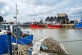 Fishing boats in Whitstable harbour, in Kent, Uk on a spring day Royalty Free Stock Photo