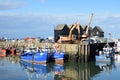 Fishing Boats in Whitstable Harbour with warehouse in background