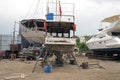 Fishing boats, wooden boats and ships on the lift in a shipyard in Bodrum, Turkey