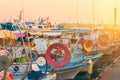 Fishing boats and yachts at sunset in Limassol old port, Cyprus. Mediterranean sea and Greek culture Royalty Free Stock Photo