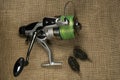 Fishing, carp reel with fishing linel on the background of burlap Royalty Free Stock Photo