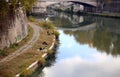 Fishing into the city river, Tiber embankment, Rome, Italy