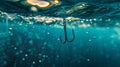 Fishing. Close-up shut of a fish hook under water Royalty Free Stock Photo