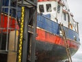 Fishing cutter with ladder on the slipway Royalty Free Stock Photo