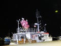 A fishing cutter with marker flags for fish traps