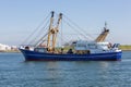 Fishing cutter sailing into harbor Vlissingen, The Netherlands