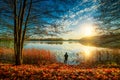 fishing in fall sunrise, forest lake and beautiful scenic fall nature Royalty Free Stock Photo