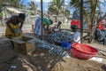 A fishing family sort dried fish on Negombo beach in Sri Lanka.