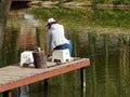 Fishing at the fish farm in the park VDNH in Moscow. May, 2016. Royalty Free Stock Photo
