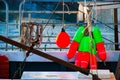 Fishing floats tied to railing on Fishboat