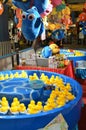 Fishing game of yellow ducks at the carnival