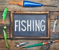 Fishing gear and blackboard Royalty Free Stock Photo