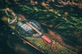 Fishing gear lying on the bank of a forest stream. Fly fishing and tenkara Royalty Free Stock Photo