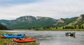 Fishing guide setting up at camp early on the river in the morning Royalty Free Stock Photo