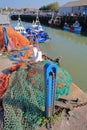 WHITSTABLE, UK - OCTOBER 15, 2017: The fishing Harbor with colorful fishing nets in the foreground