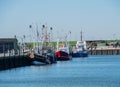 Fishing harbor in North Sea Schleswig-Holstein with various fish cutters Royalty Free Stock Photo