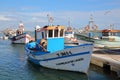 The fishing harbor of Santa Luzia, located near Tavira, with colorful fishing boats mooring along a jetty Royalty Free Stock Photo