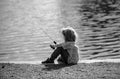 Fishing hobby. Child fishing on the lake. Boy with spinner at river. Kid at jetty with rod.