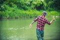 Fishing hobby and summer weekend. Bearded men fisher with fishing rod.