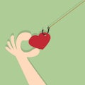 On fishing hook hanging heart. Royalty Free Stock Photo