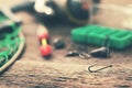 Fishing hook and other equipment on old table Royalty Free Stock Photo